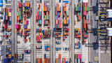  Aerial top view of logistic import export transportation business, industrial port with containers.