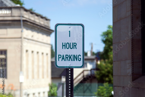 1 Hour Parking sign on a city street allows to park cars only for one hour