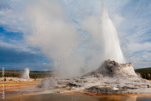 Castle Geyser and Beehive Geyser erupting simultaneously in Upper Geyser Basin, Yellowstone National Park, Wyoming
