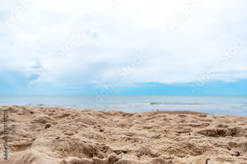 Landscape image of sand on tropical beach with blue sky background