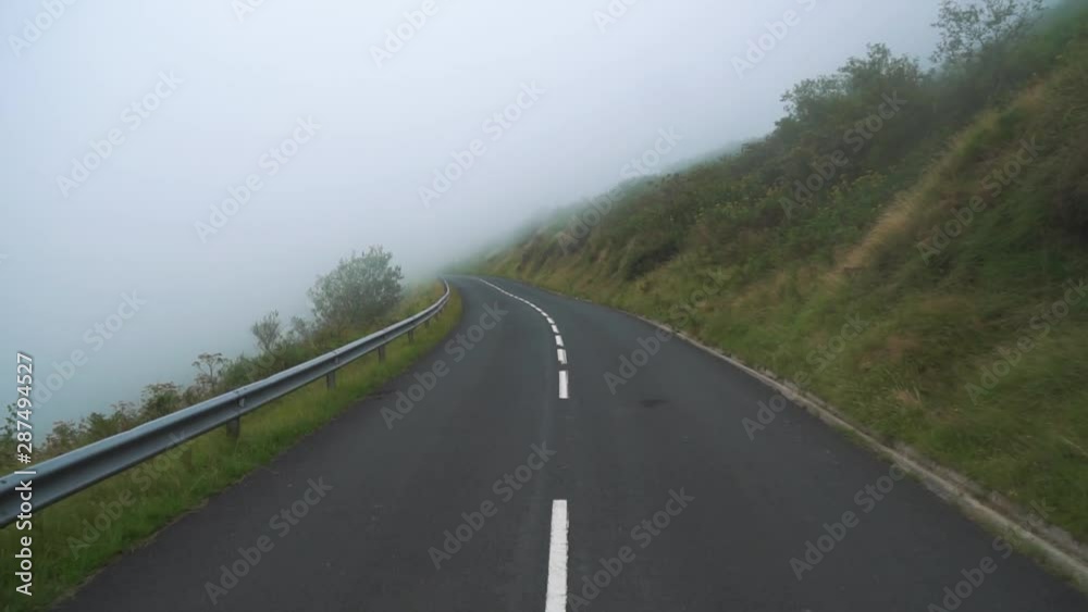 A car is moving along a little mountain street, shot in slow motion with a gimbal. The landscape is passing by. A car is moving along a little mountain street, shot in slow motion with a gimbal. The landscape is passing by.