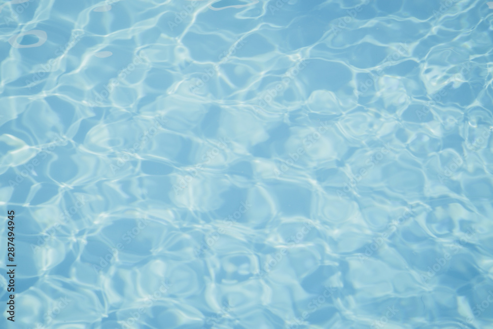 Obraz premium Blue pool water with sun reflections