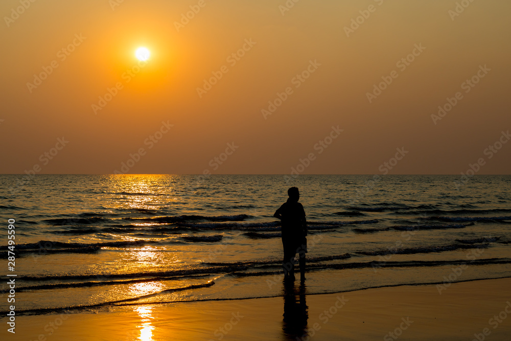 Siluate lovers and beach before sunset Siluate lovers and beach before sunset