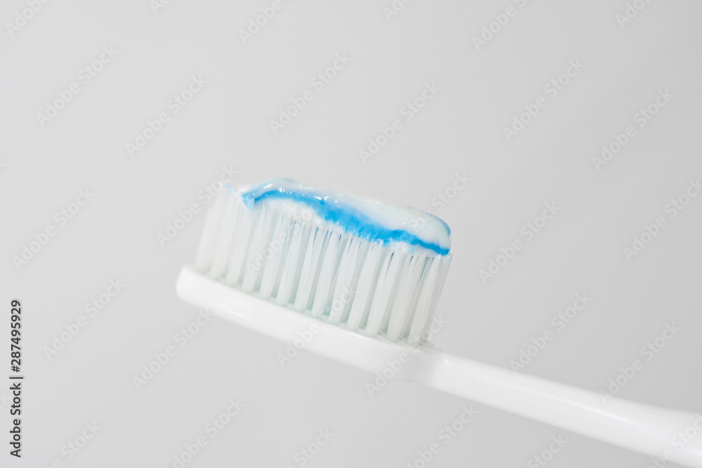 Toothbrush and toothpaste on white background.soft focus. Toothbrush and toothpaste on white background.soft focus.
