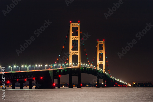 Obraz na plátně The Mackinac Bridge fully illuminated at night