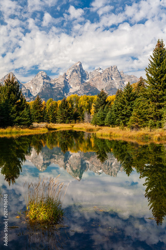 Mountains and trees of the Grand Teton range reflected in the ponds at Schwabacher Landing, Grand Teton National Park, Wyoming