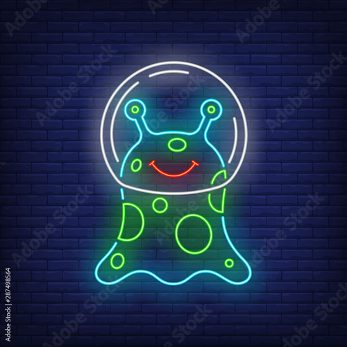 Smiling non-humanoid alien wearing glass helmet neon sign