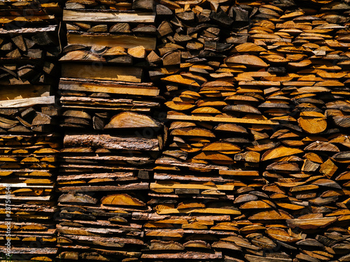 Neatly stacked firewood for kindling the oven in winter