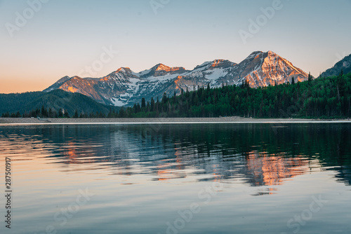 Mountains reflecting in Silver Lake Flat Reservoir at sunset, near the Alpine Loop Scenic Byway in American Fork Canyon, Uinta-Wasatch-Cache National Forest, Utah photo