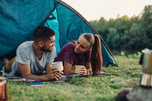 couple on camping drinking coffee or tea