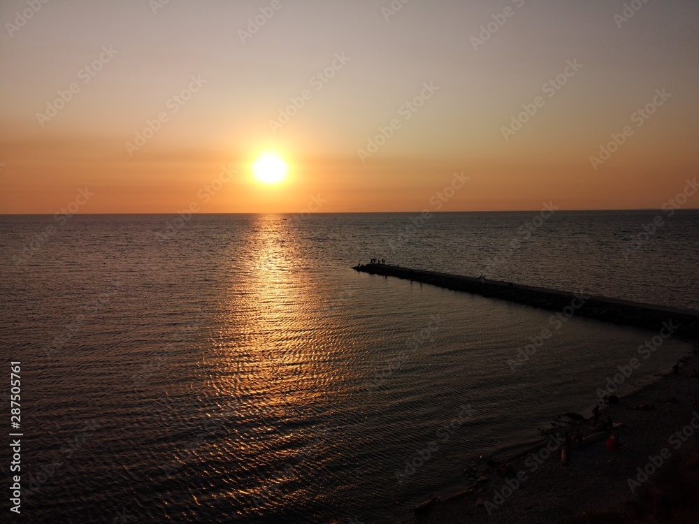 Sunset on the beach of the black sea