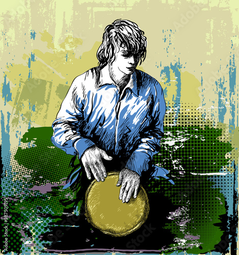 Man, drummer playing the djembe