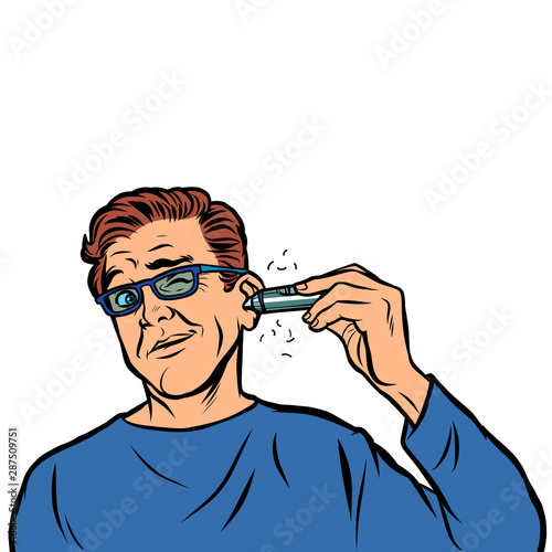 a man shaves hair in his ear
