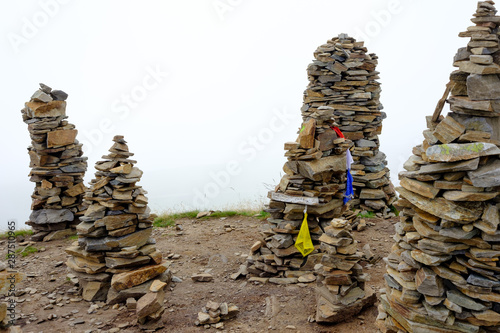 stone figures, stone piles on the summit of mountain steinermandl, lienz, tyrol, austria photo