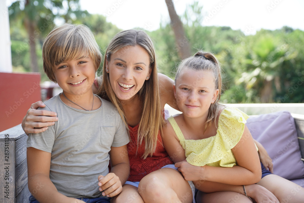 Portrait of happy mother and kids on summer vacation Portrait of happy mother and kids on summer vacation