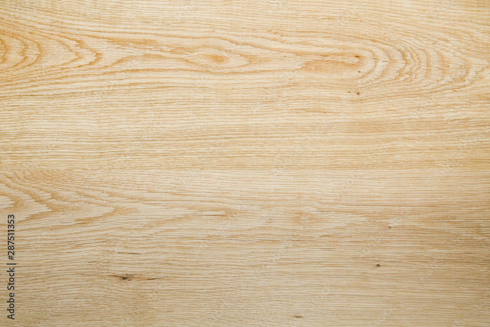 Natural light oak wood texture for background and design. Close-up.From two boards.