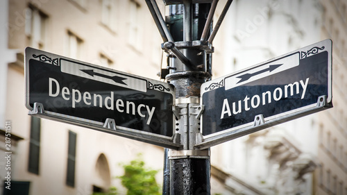 Street Sign to Autonomy versus Dependency photo
