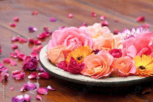 Colorful Autumn Flowers In A Rustic Bowl