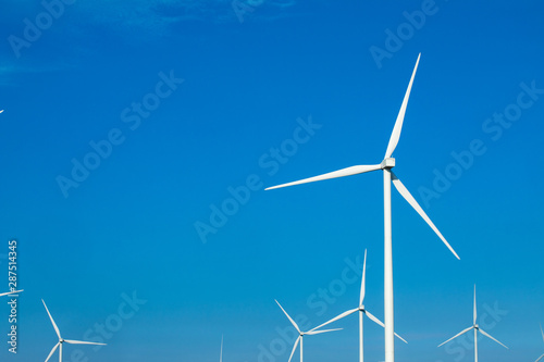 green meadow with Wind turbines generating electricity © Tawanboonnak