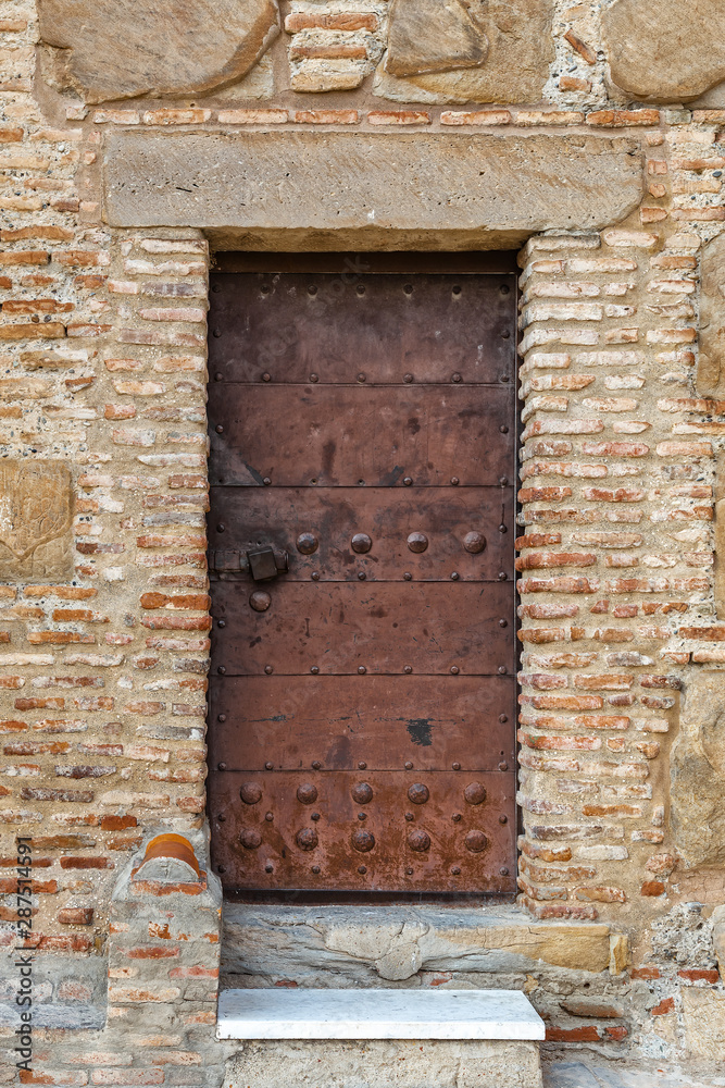 Antique metal door with rivets