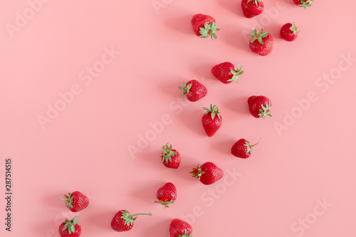 Strawberries on pink background. Strawberries berries pattern. Creative food concept. Flat lay, top view, copy space
