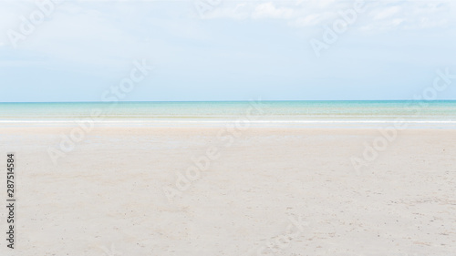 Beautiful beach clear sea and sand with free space. ( Panorama Ratio )