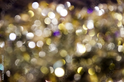 Close up sparkling silver metallic tinsel background blurred