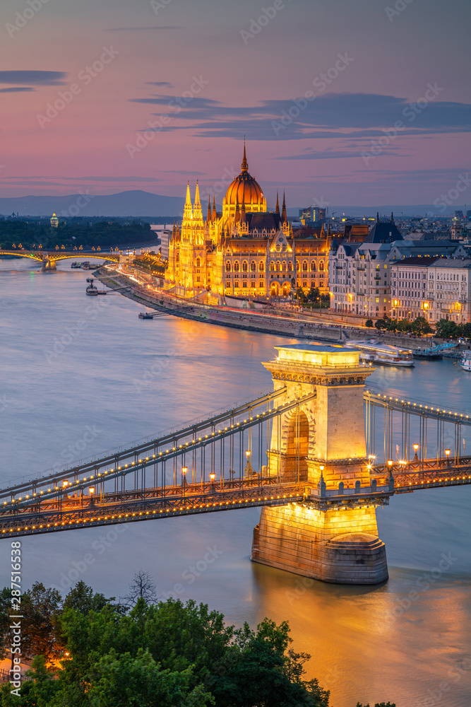 Budapest, Hungary. Aerial cityscape image of Budapest with Szechenyi Chain Bridge and parliament building during summer sunset.