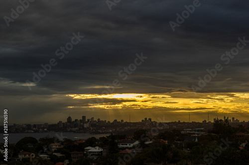 Sydney Panorama taken from a unique position at sunset  sunrays shining on the city