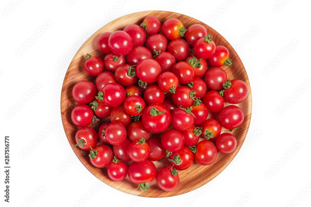 Top view of cherry tomatoes on the wooden dish Top view of cherry tomatoes on the wooden dish
