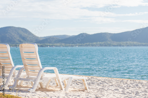 Beautiful beach. Chairs on the sandy beach near the sea. Summer holiday and vacation concept for tourism. Inspirational tropical landscape