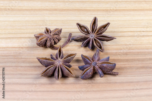 Dried star anise fruits on the wooden surface