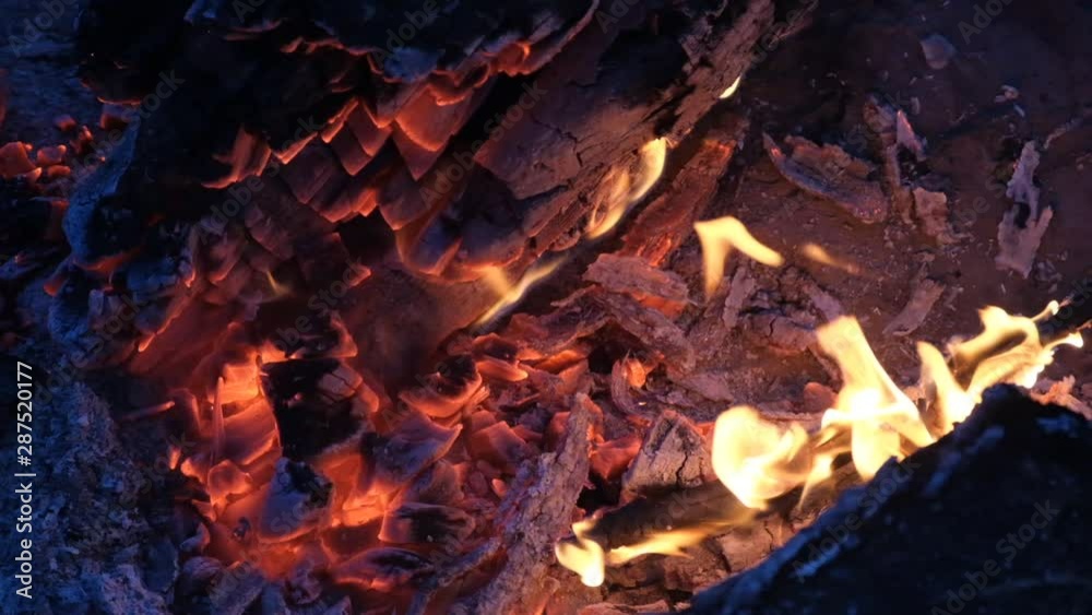 close up bonfire flames of camping fire, Super slow motion burning firewood. close up bonfire flames of camping fire, Super slow motion burning firewood.