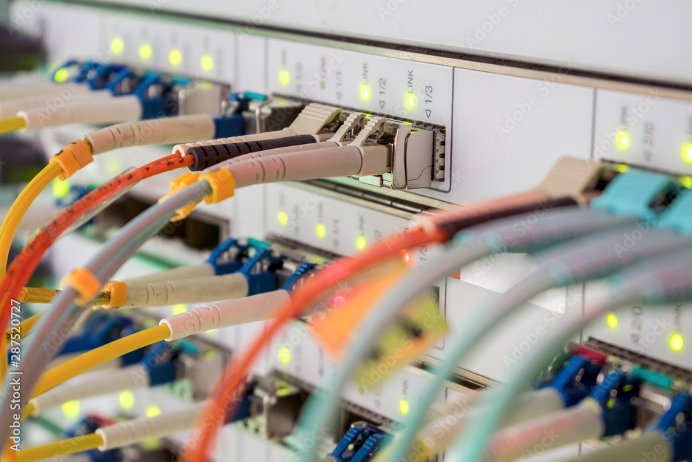 Internet wires are connected to the central router interfaces. There are many optical patchcards in the data center server room. Telecommunications cables are connected to the main server. Internet wires are connected to the central router interfaces. There are many optical patchcards in the data center server room. Telecommunications cables are connected to the main server.