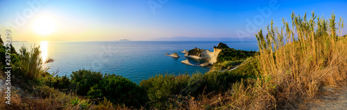 Cape Drastis at sunset close to Peroulades and Sidari village - Beautiful coast scenery with High cliffs and paradise beach - Corfu, Ionian island, Greece photo