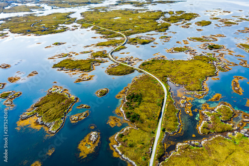 Scenic aerial view of beautiful road with bridge on the island Smola, Norway