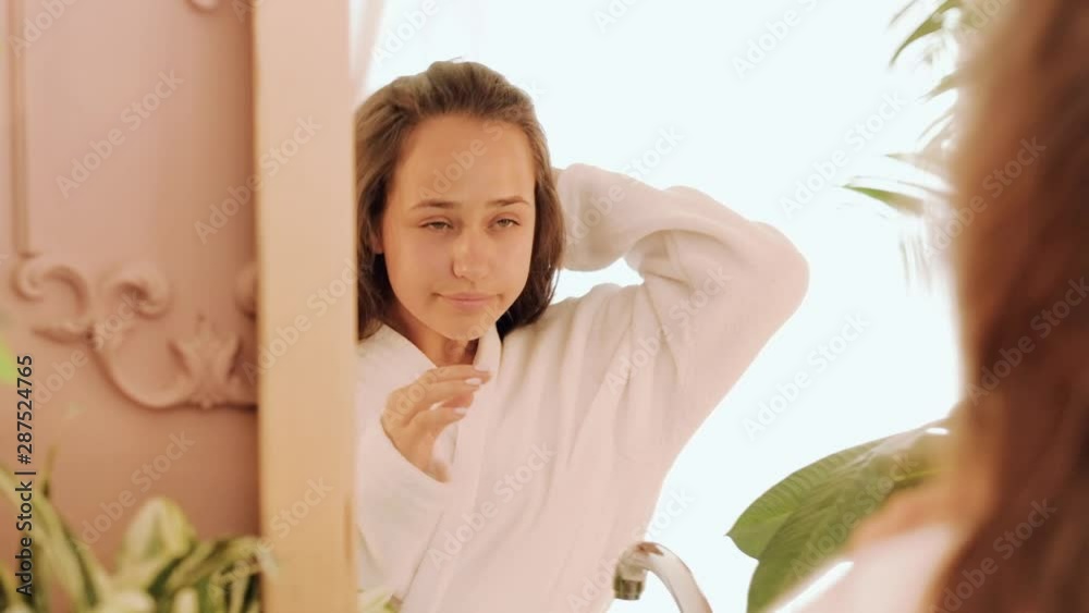 Natural female beauty. Health wellness purity. Teenage girl in bathrobe flaunting in mirror. Natural female beauty. Health wellness purity. Teenage girl in bathrobe flaunting in mirror.
