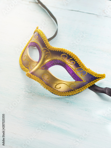 Mardi gras mask on pastel background.