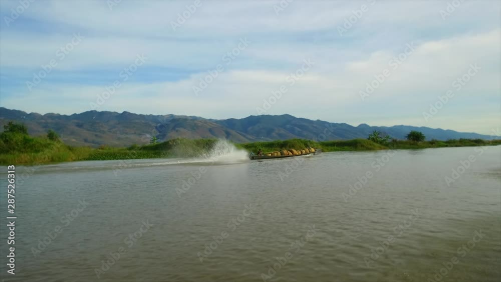 Inle lake Shan State Myanmar.Floating Gardens and Villages. Commerce and Trade primarily by Long Boats. Surreal vision with mountainous backdrops. Inle lake Shan State Myanmar.Floating Gardens and Villages. Commerce and Trade primarily by Long Boats. Surreal vision with mountainous backdrops.