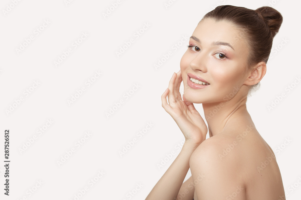 woman with clean skin touches her cheek with her hand. Perfect face skin concept on a white background. woman with clean skin touches her cheek with her hand. Perfect face skin concept on a white background.