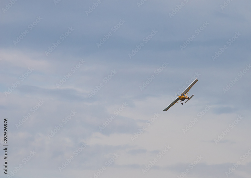 Army liaison aircraft flying in the sky Army liaison aircraft flying in the sky