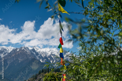 Budhist flags in the mountains near hamta photo