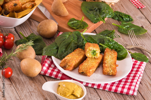 Potato croquettes with spinach and mozzarella. 