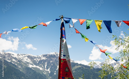 Budhist flags in the mountains near hamta photo