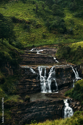 Waterfall among the green mountains. Waterfalls Of Sri Lanka. Landscapes Of Asia. Aerial photography. Tea plantation. Green hill. Mountain river. Small waterfall. Sri lanka