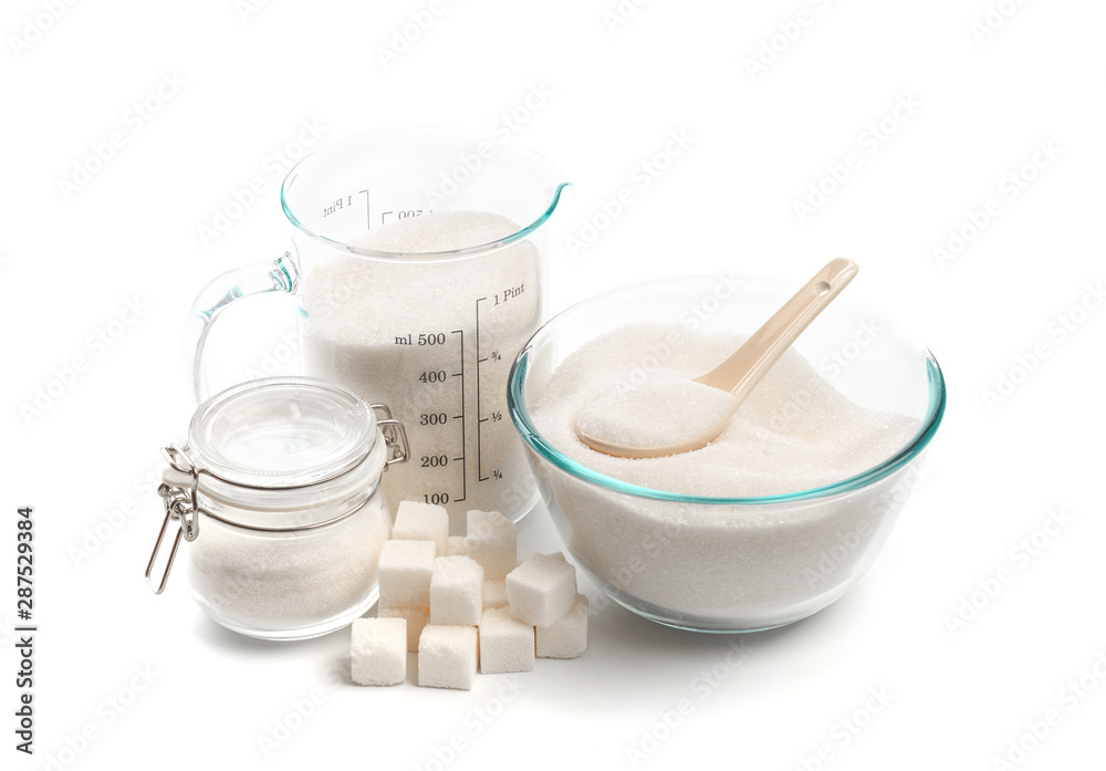 .glass beaker and bowl with sugar isolated on white background