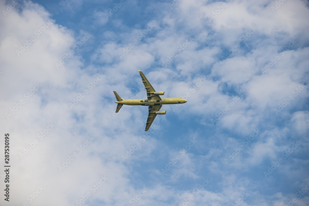 Big passenger plane flying in the cloudy sky Big passenger plane flying in the cloudy sky