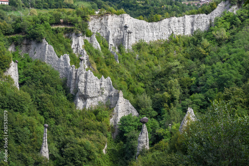 Monument rocks (Chalk Pyramids) of Zone at lake Iseo in Italy photo