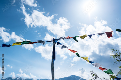 Budhist flags in the mountains near hamta photo