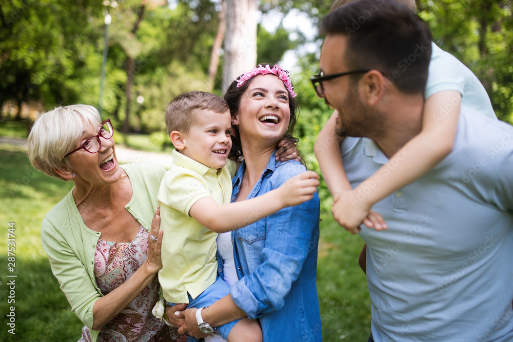 Family picnic outdoors togetherness relaxation happiness concept Family picnic outdoors togetherness relaxation happiness concept